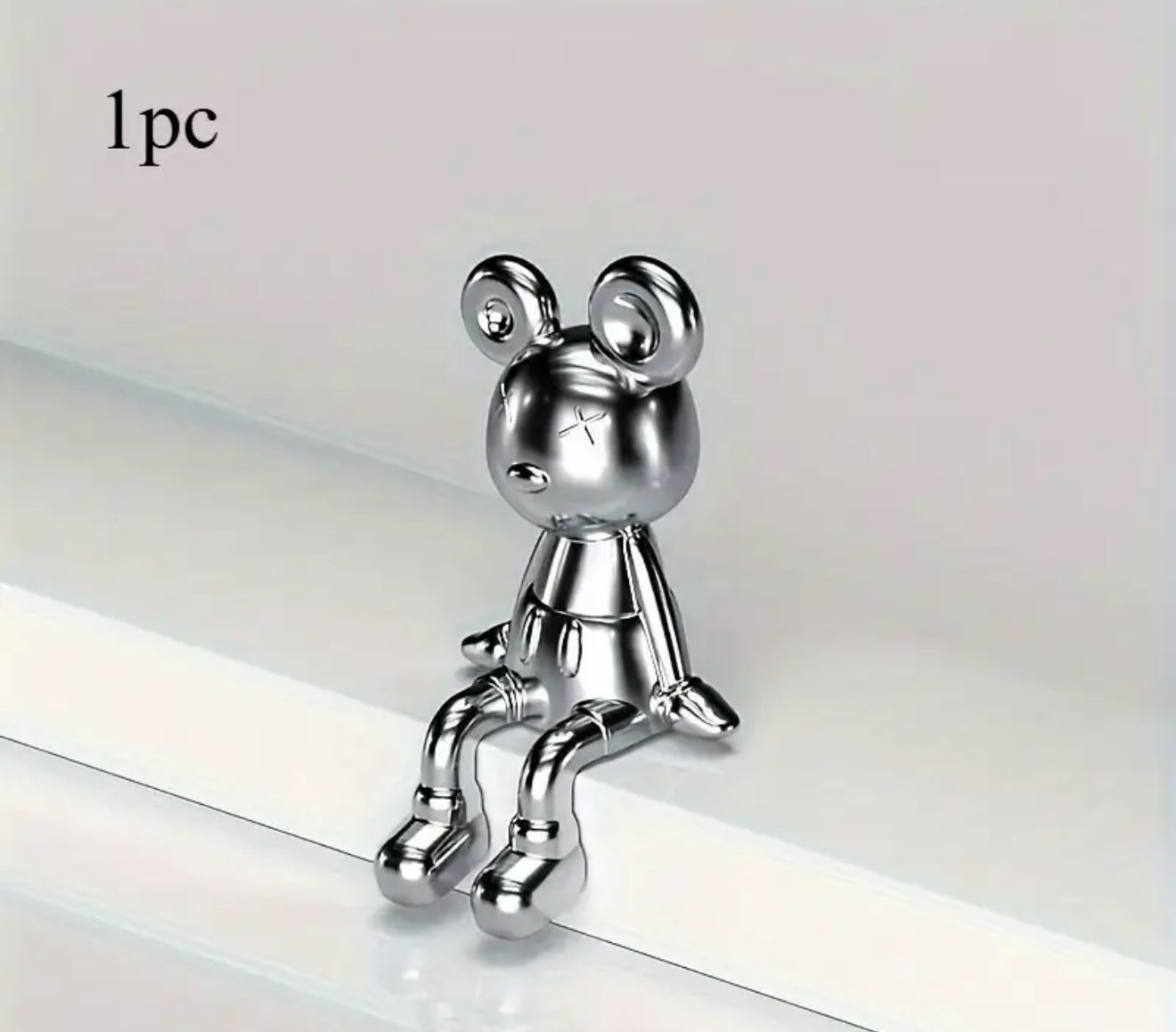 Home Decor- silver sitting figure